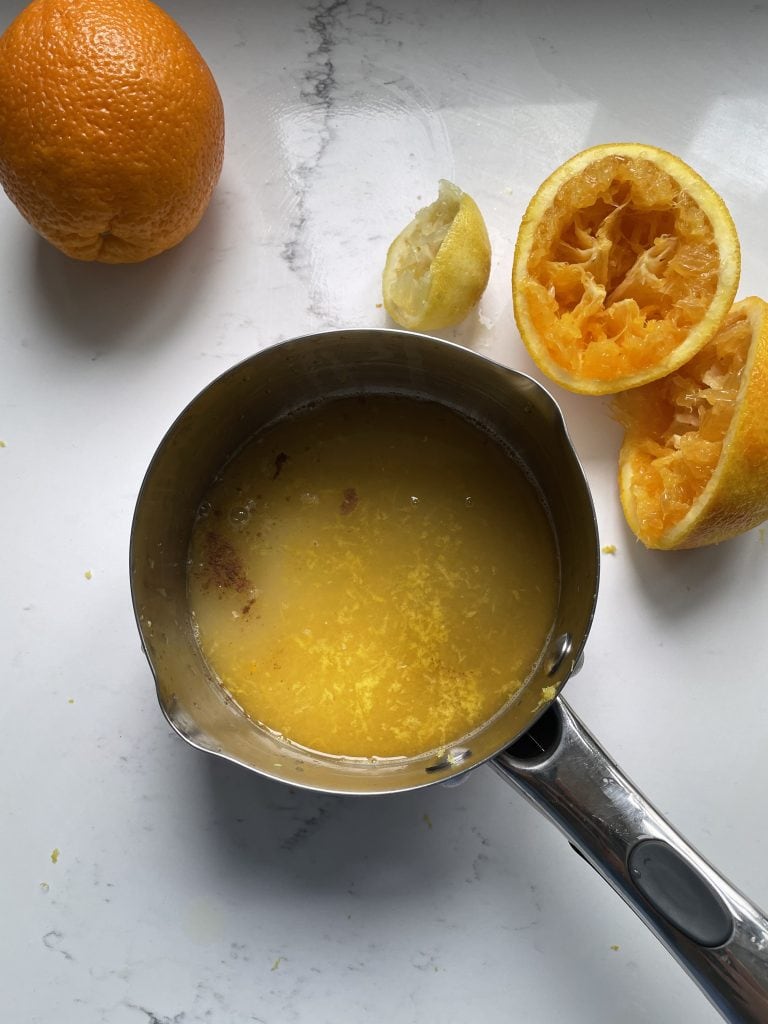 Sugar and citrus juice in the saucepan